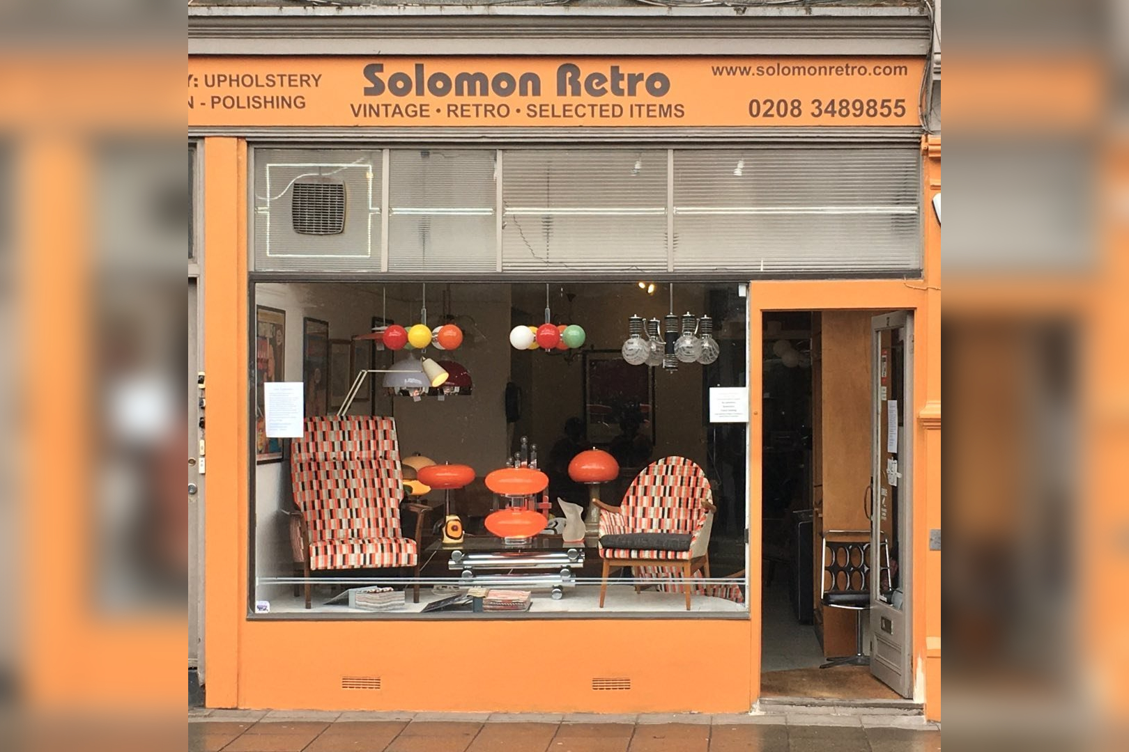 The logo of Solomon Upholstery-Retro